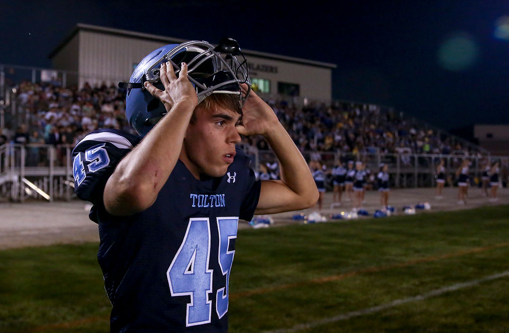 Tolton linebacker Sam Andrews removes his helmet